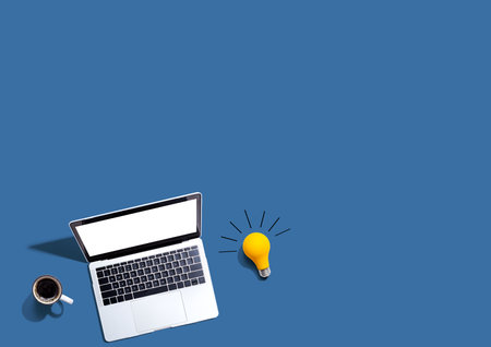 Computers with a light bulbの写真素材