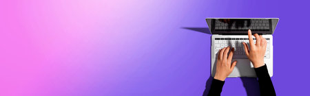 Person using a laptop computerの写真素材