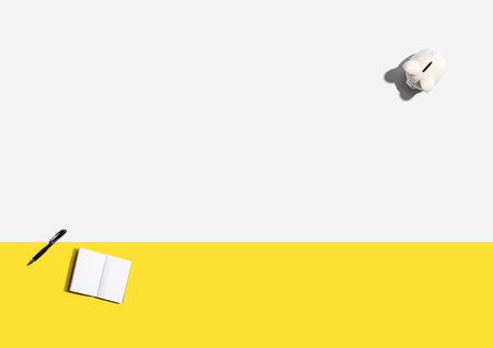 Piggy bank with a notebookの写真素材