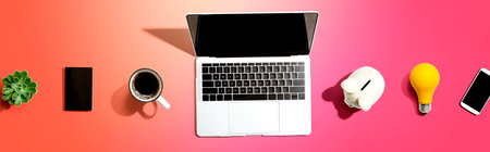 Laptop computer with a piggy bankの写真素材