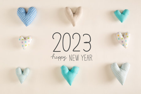 Happy New Year 2023 message with blue heart cushionsの写真素材