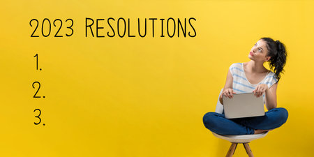 2023 Resolutions with woman using a laptopの写真素材