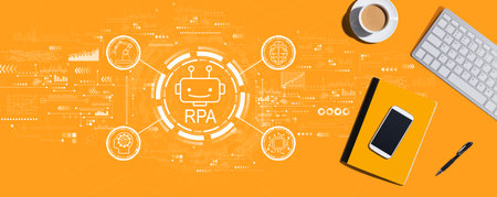 Robotic Process Automation theme with computer keyboard and office itemsの写真素材