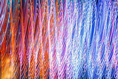 Abstract blurred bokeh neon light trails background