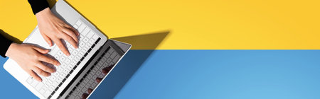 Person using a laptop computerの写真素材