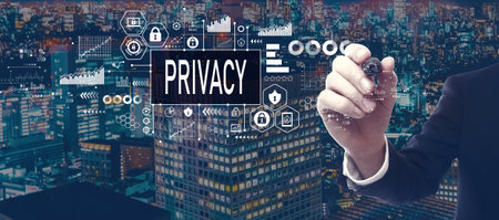 Privacy theme with businessman in city at nightの写真素材