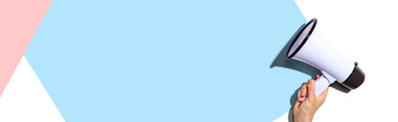 Attention and announcement concept with a megaphoneの写真素材