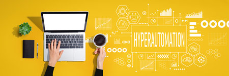 Hyperautomation theme with person using laptop computerの写真素材