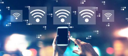 Wifi concept with city lights at nightの写真素材