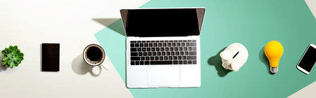 Laptop computer with a piggy bankの写真素材
