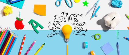 Brainstorming concept with a light bulb and school suppliesの写真素材