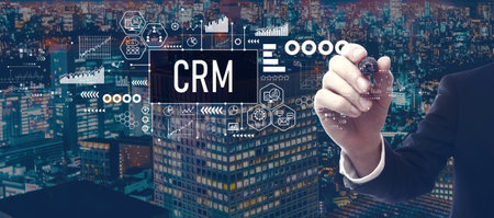CRM theme with businessman in city at nightの写真素材