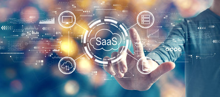 SaaS - software as a service concept with man on blurred city light backgroundの写真素材