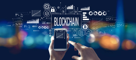 Blockchain theme with person using a smartphone at nightの写真素材
