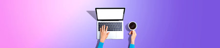 Person using a laptop computerの写真素材