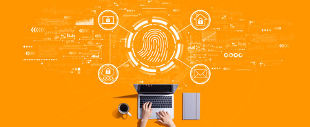 Fingerprint scanning theme with person working with laptopの写真素材