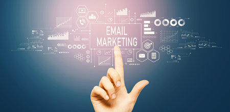 Email marketing with hand pressing a buttonの写真素材