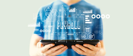 Payroll theme with man using a tabletの写真素材
