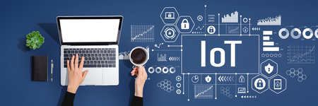 IoT theme with person using laptop computerの写真素材