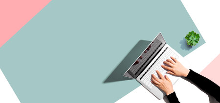 Person using a laptop computerの写真素材
