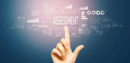 Assessment concept with hand pressing a buttonの写真素材