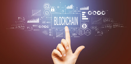 Blockchain theme with hand pressing a buttonの写真素材