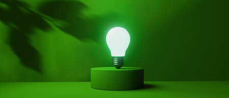 Light bulb on a podium with shadow of leaves - 3Dの写真素材
