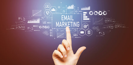 Email marketing with hand pressing a buttonの写真素材