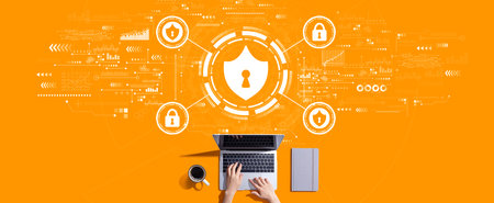 Cyber security theme with person working with laptopの写真素材
