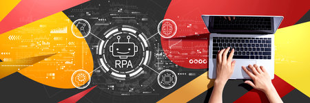 Robotic Process Automation theme with person using a laptopの写真素材