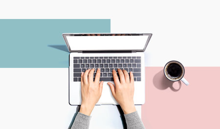 Person using a laptop computerの写真素材