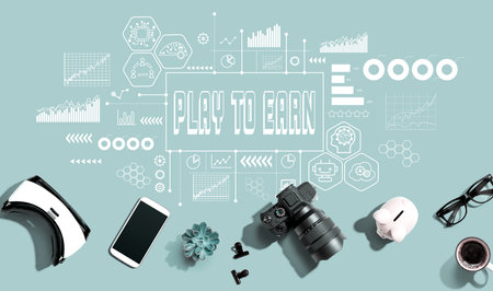 Play to Earn theme with electronic gadgets and office suppliesの写真素材