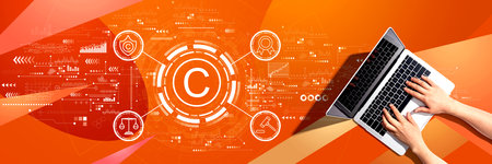 Copyright concept with person using a laptopの写真素材