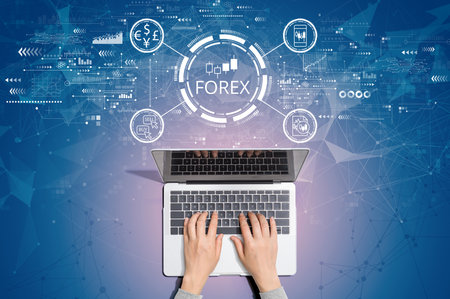 Forex trading concept with person using laptopの写真素材