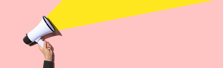 Attention and announcement concept with a megaphoneの写真素材