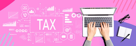 Tax theme with person using a laptopの写真素材