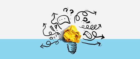 Brainstorming concept with a crumpled paper light bulbの写真素材