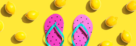 Summer concept with flip flops and lemonsの写真素材
