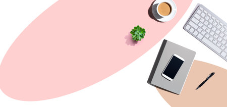 Desk items - keyboard, smart phone, coffee and a penの写真素材