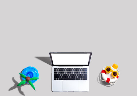 Laptop computer with summer theme itemsの写真素材