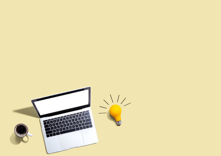 Computers with a light bulbの写真素材