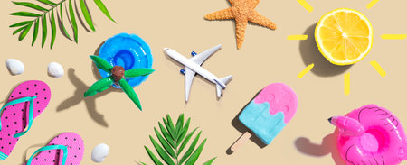 Summer concept with a airplane, an ice cream, flip flops and lemon sunshineの写真素材