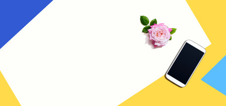 Smartphone with a pink roseの写真素材