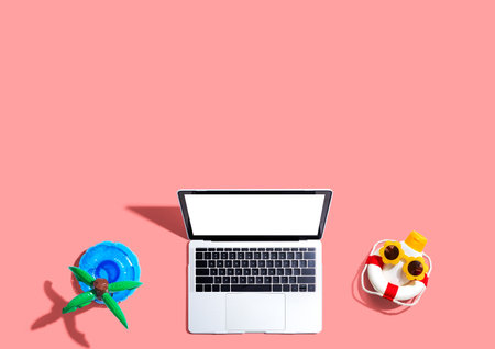 Laptop computer with summer theme itemsの写真素材