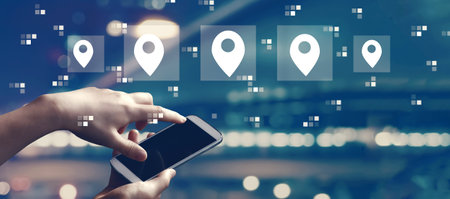 Map pin concept with person using smartphoneの写真素材
