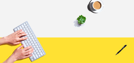 Woman using a computer keyboardの写真素材
