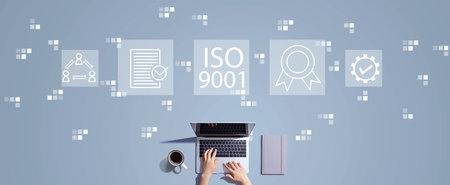 ISO 9001 concept with person working with laptopの写真素材