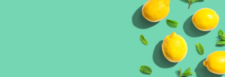 Fresh yellow lemons with mints overhead viewの写真素材