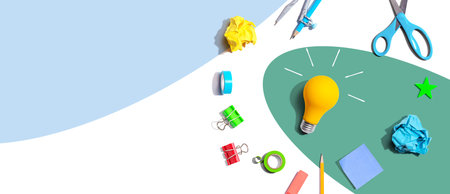 Idea light bulb with school supplies - flat layの写真素材