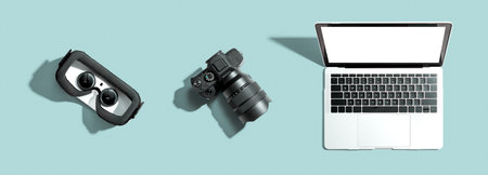Tech gear theme with vr headset, dslr camera and laptopの写真素材
